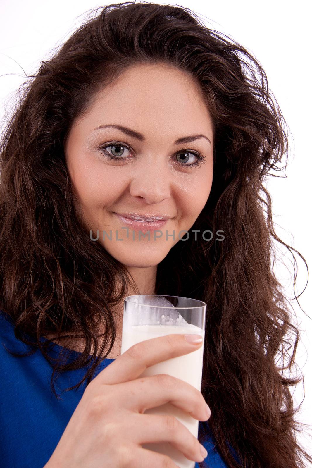 beautiful smiling woman is drinking milk isolated on white background