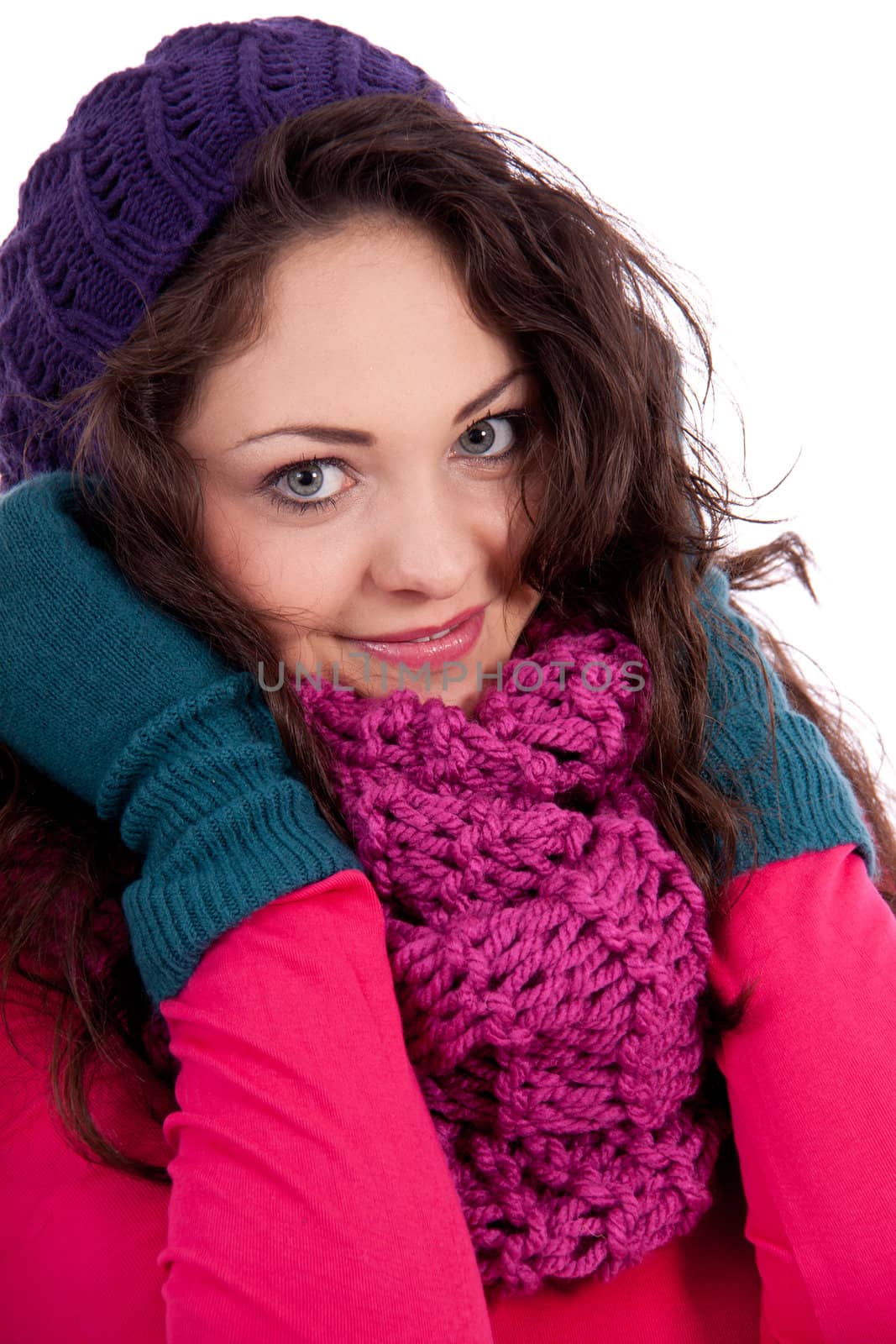 beautiful young smiling girl with hat and scarf in winter isolated on white background
