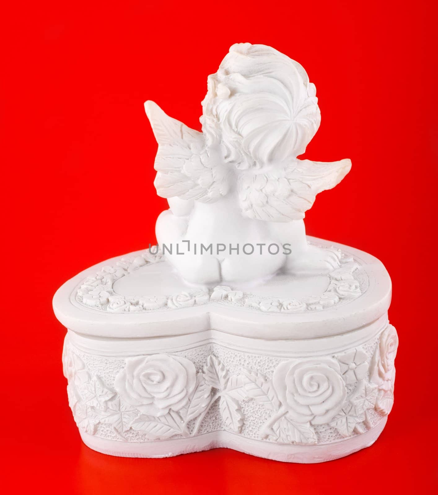 angel isolated on red background