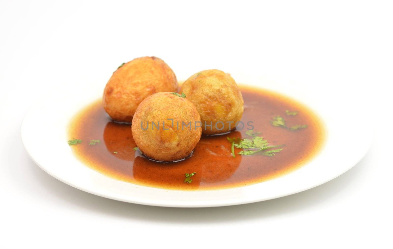 boiled egg fried with tamarind sauce on white background