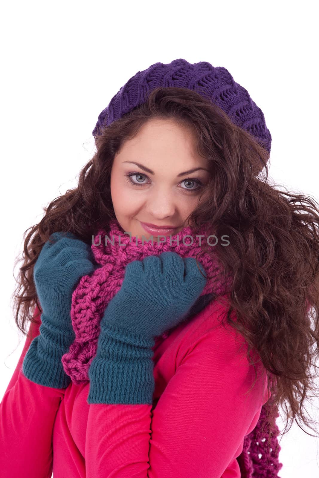 beautiful young smiling girl with hat and scarf in winter isolated on white background