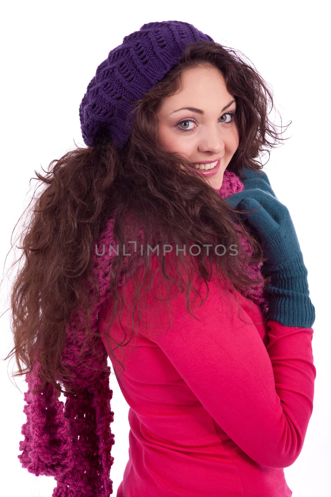 beautiful young smiling girl with hat and scarf in winter isolated on white background