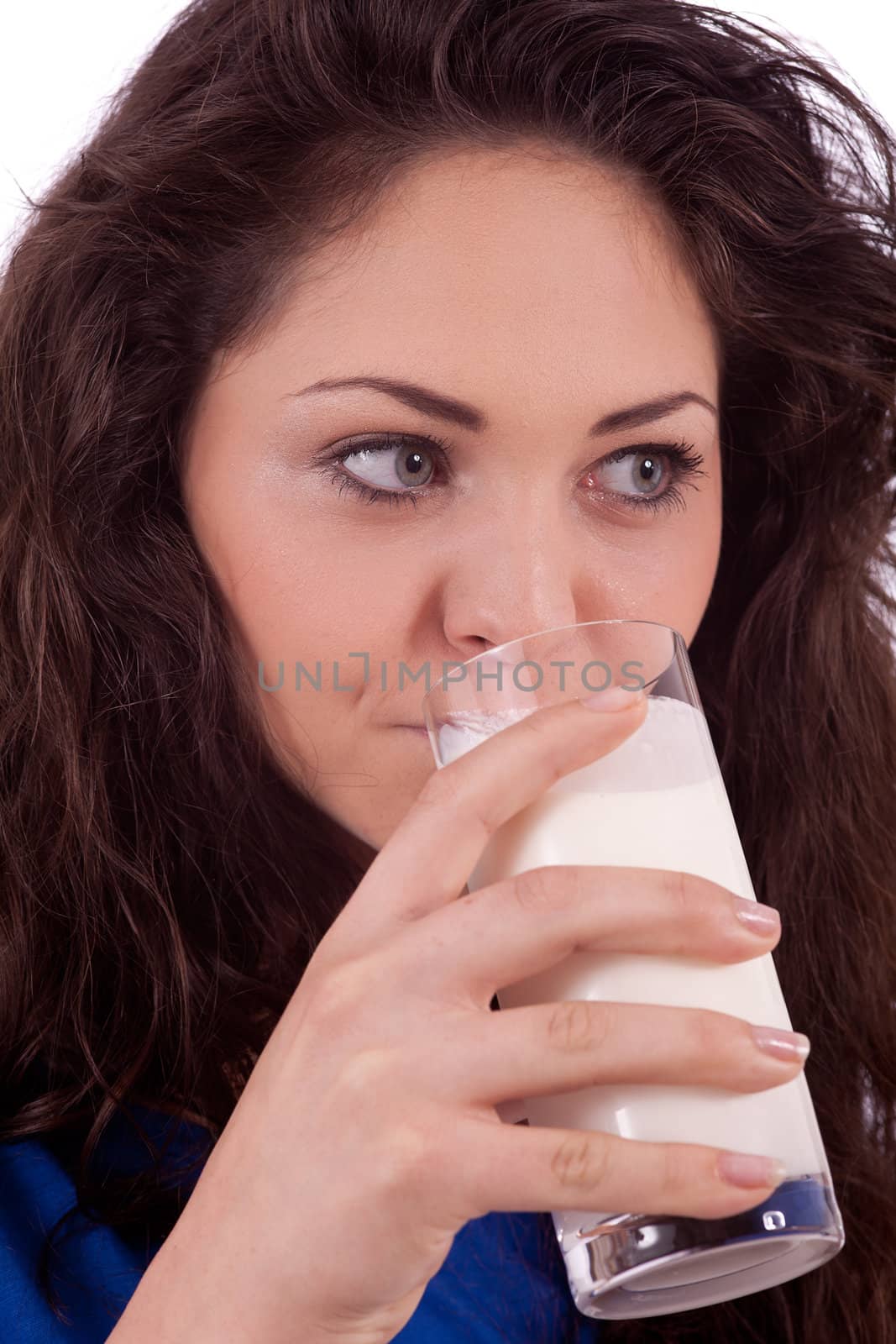 beautiful smiling woman is drinking milk isolated on white background