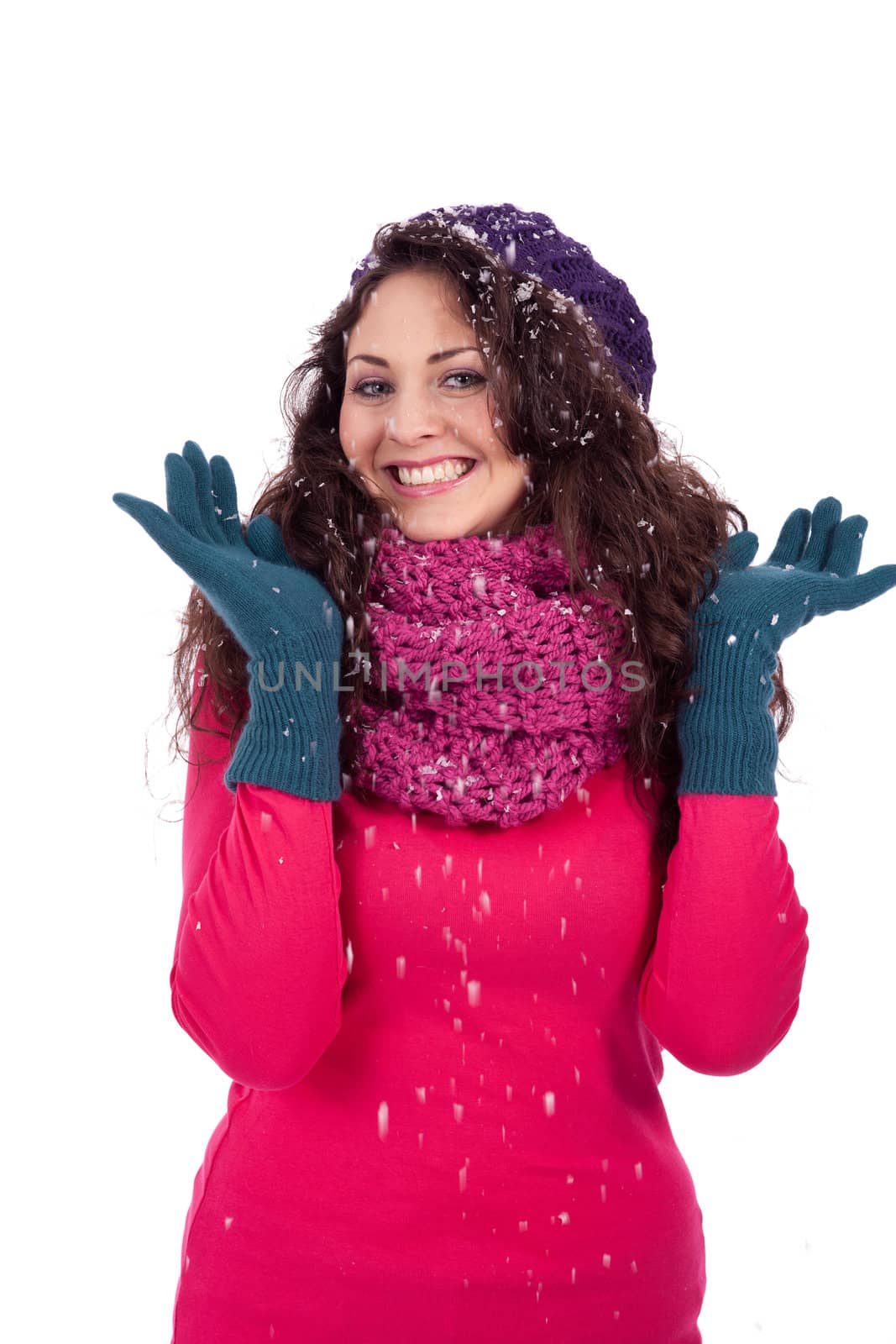 beautiful smiling brunette woman in snow in winter  isolated on white background