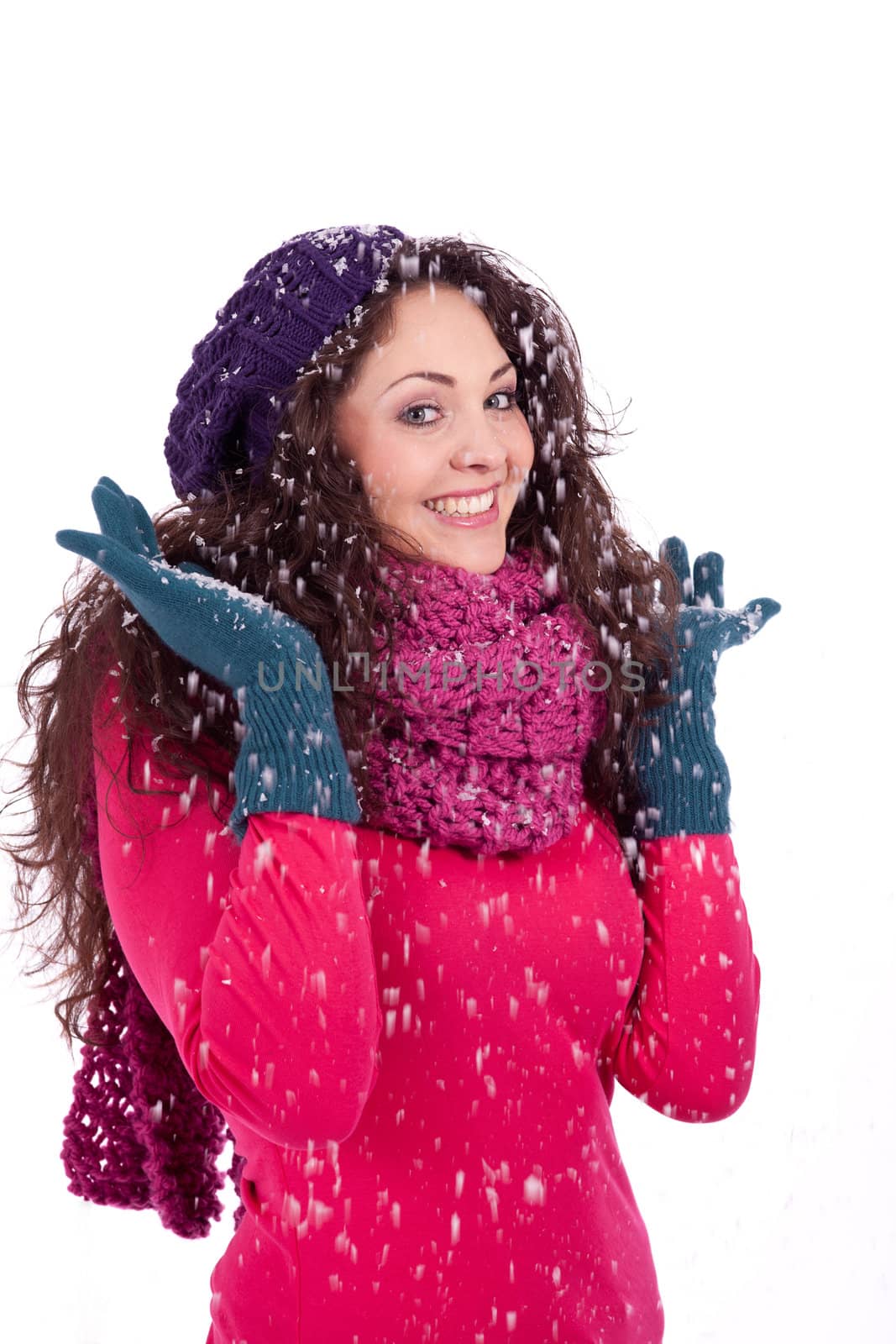 beautiful smiling brunette woman in snow in winter  isolated on white background