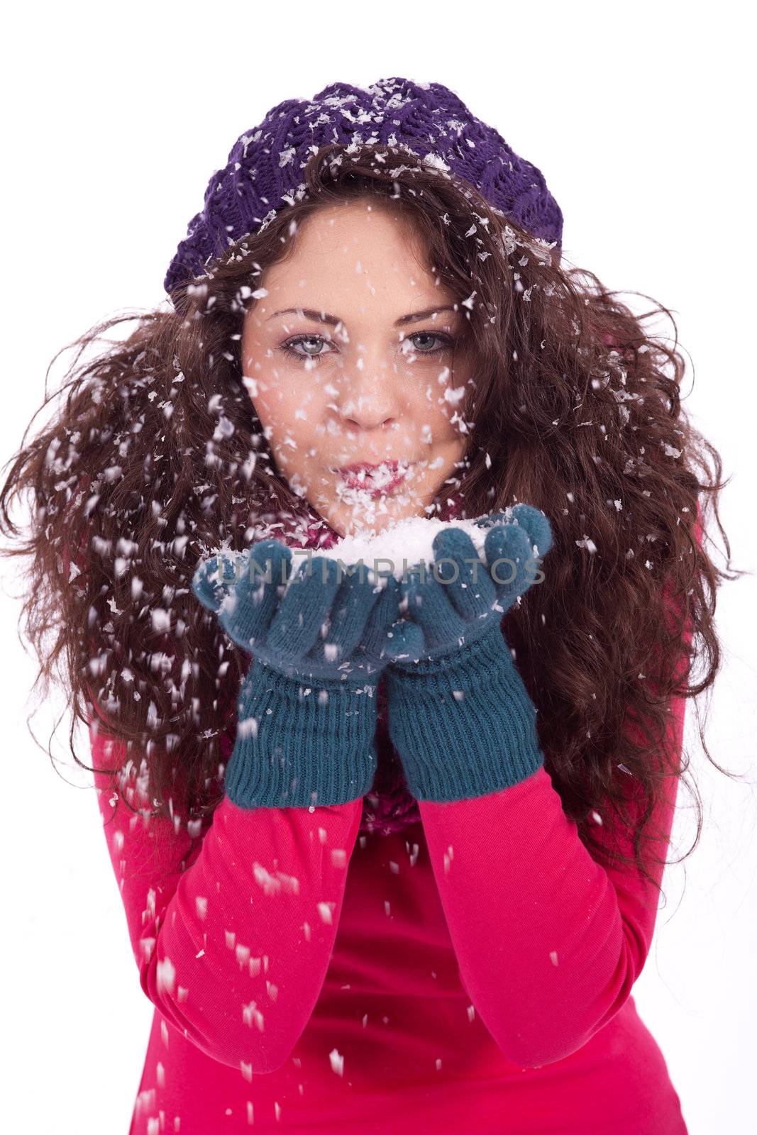 beautiful smiling brunette woman in snow in winter  isolated on white background