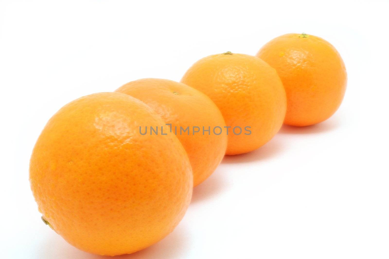 Four oranges over white background