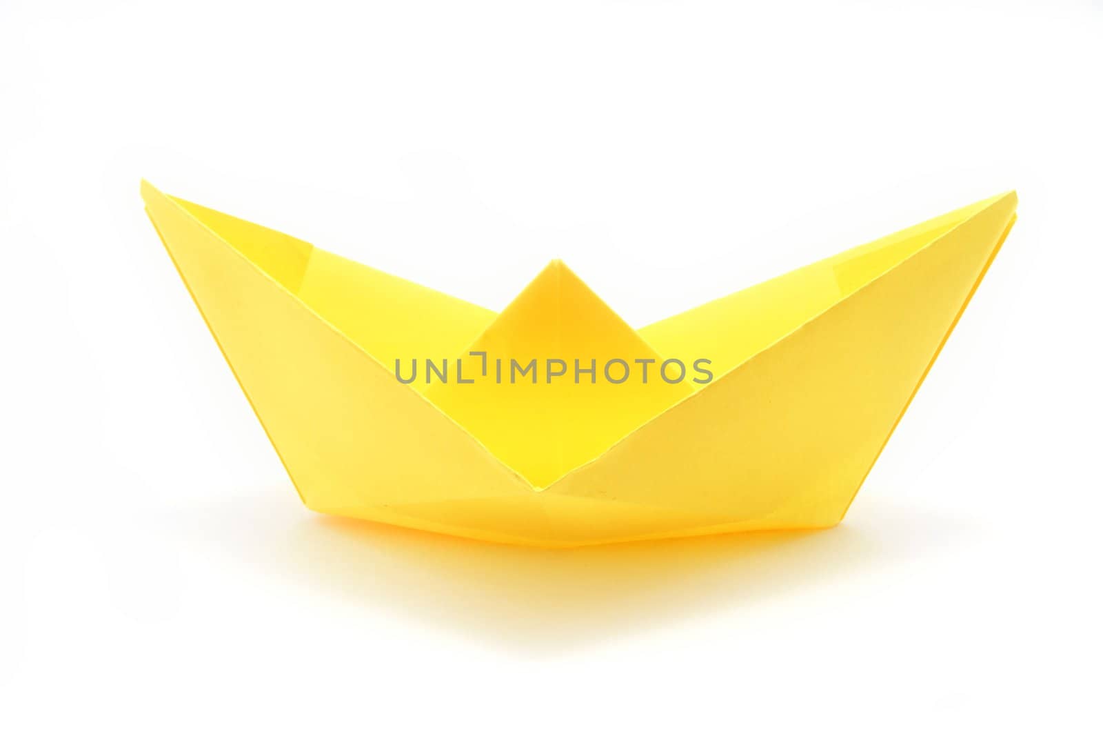 Yellow paper boat over white by Autre