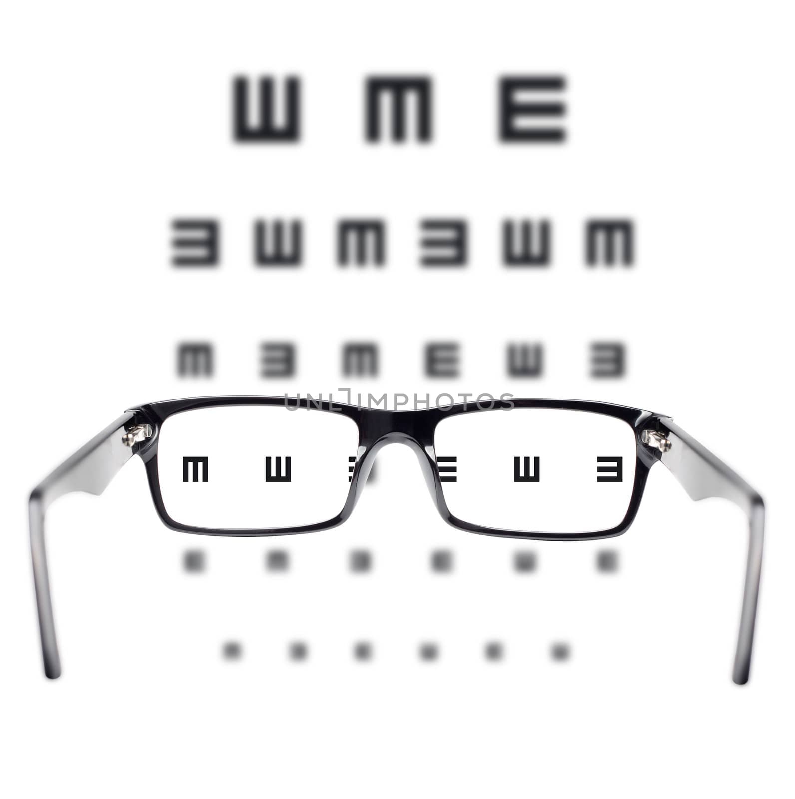 Sight test seen through eye glasses, white background isolated