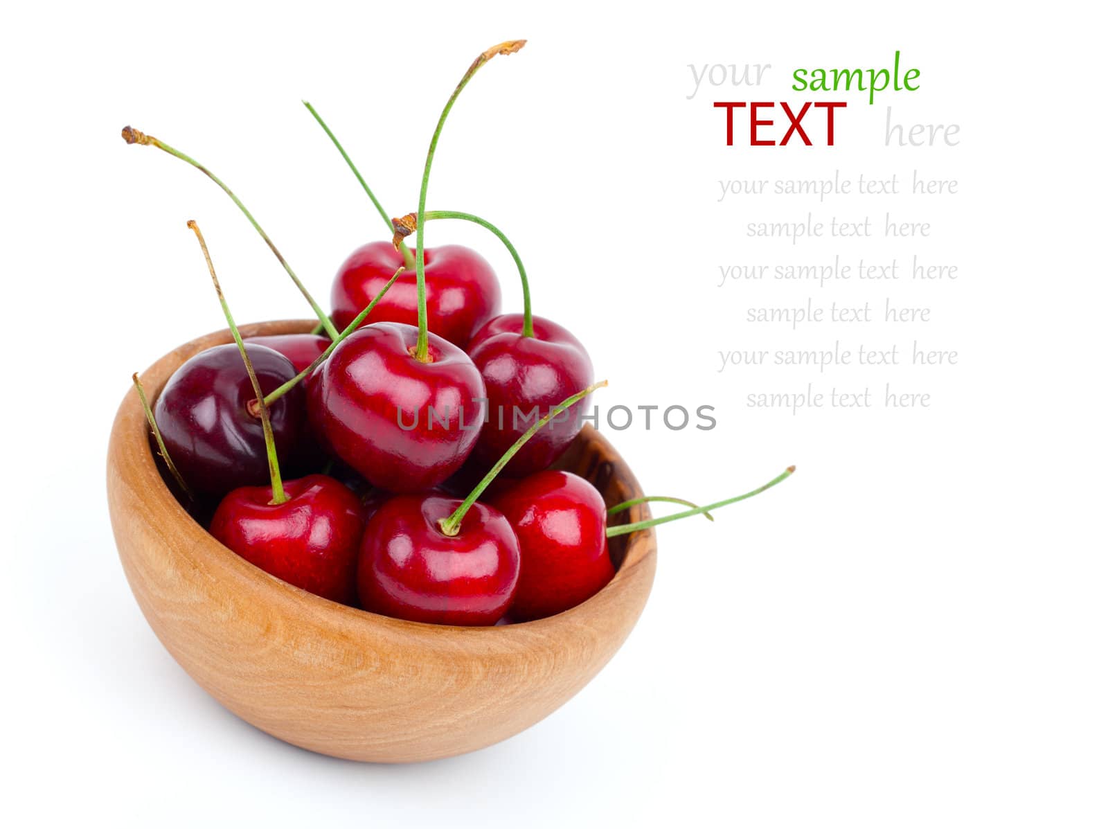 Cherry in wooden bowl isolated on white background