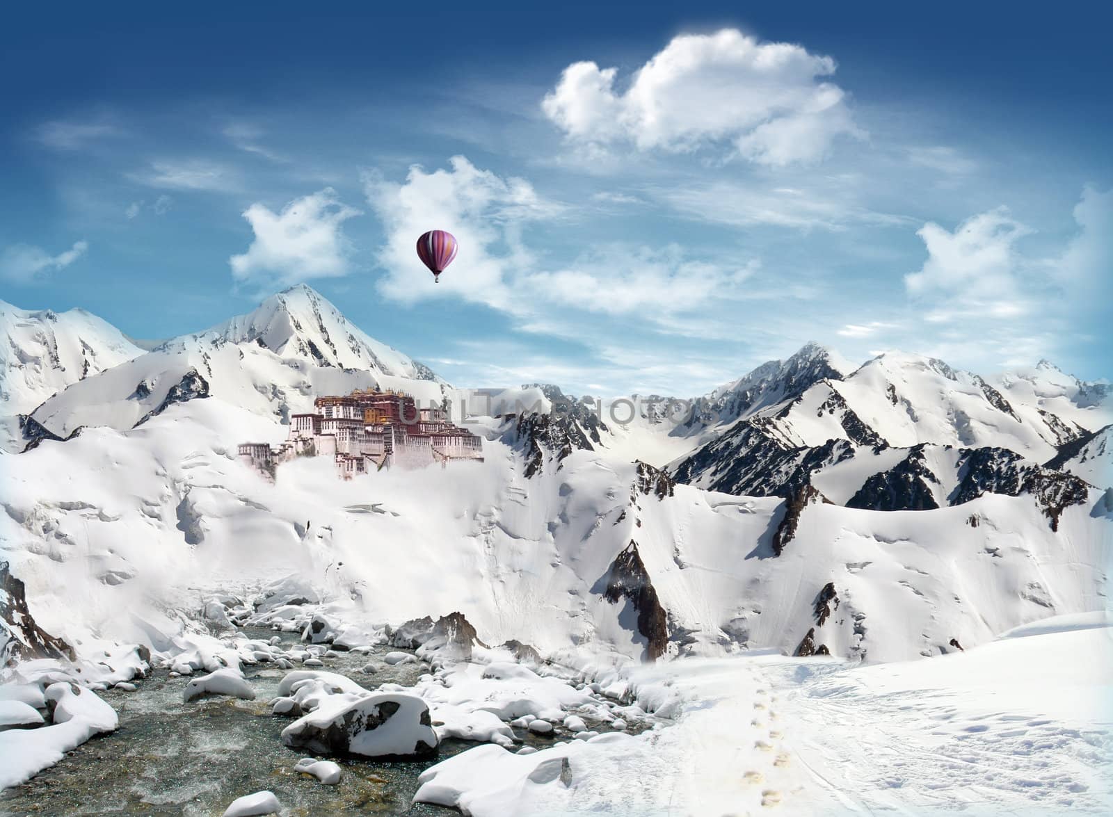 Tibetan landmark among the mountain with snowfield and stream and blue sky and clouds in the background