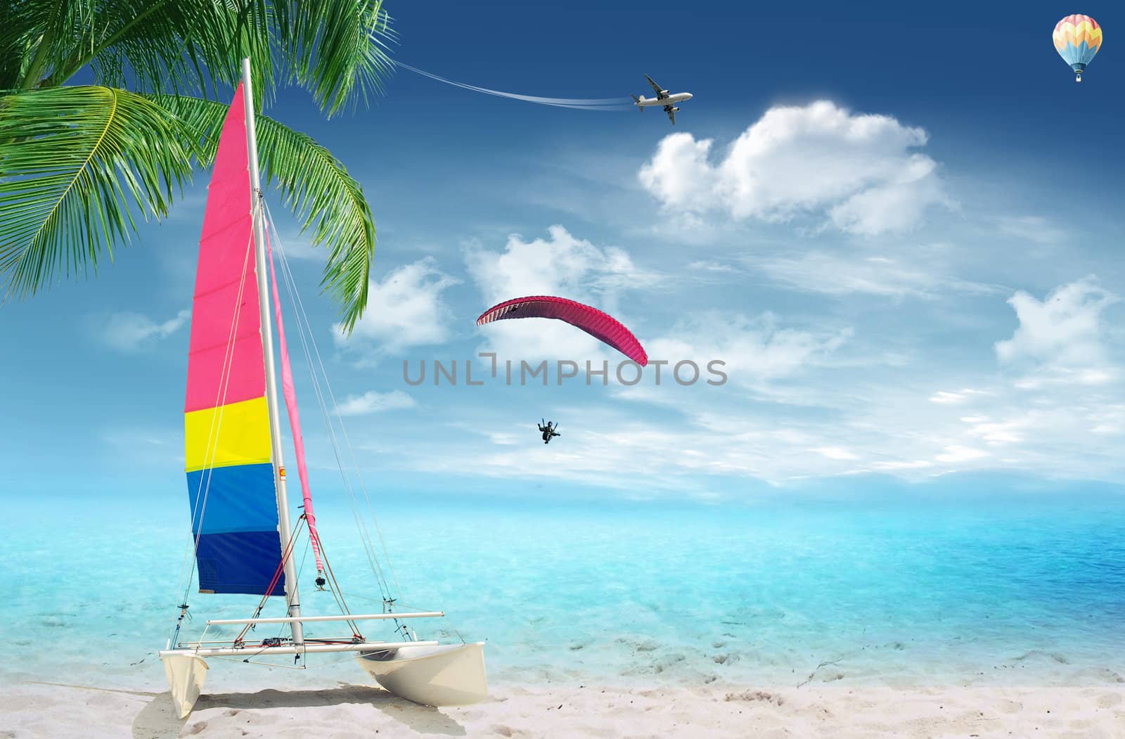 Tropical beach with sailing boat and palm tree