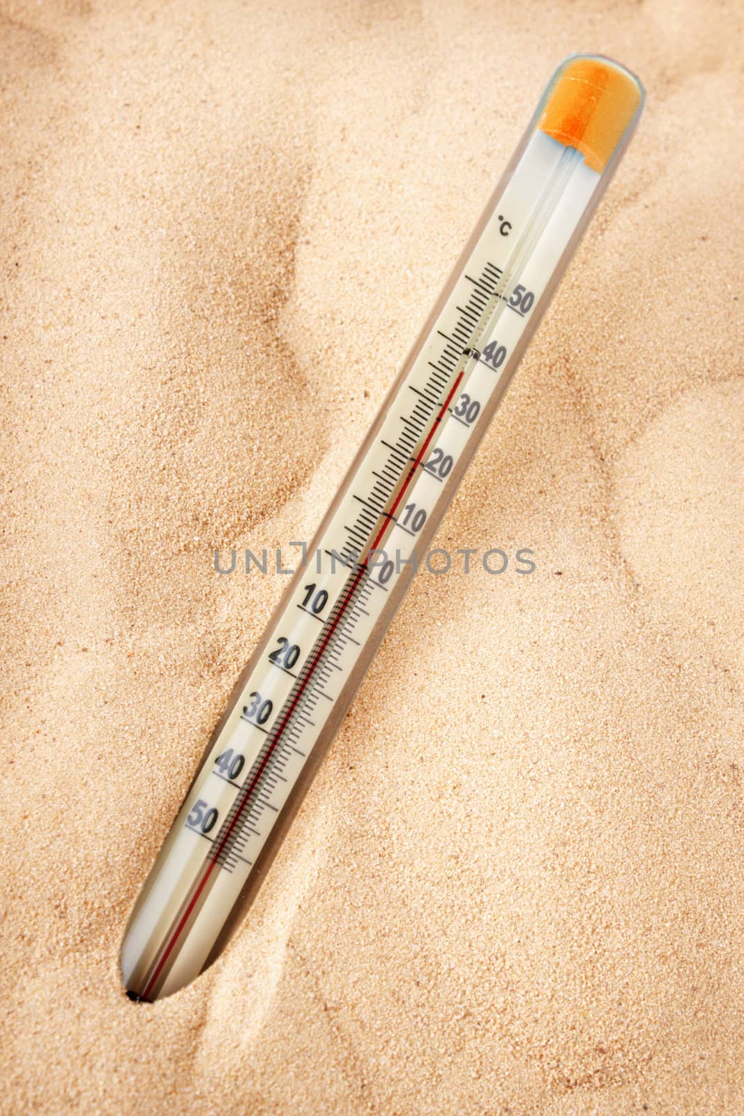 Thermometer shows the intense heating of the sand