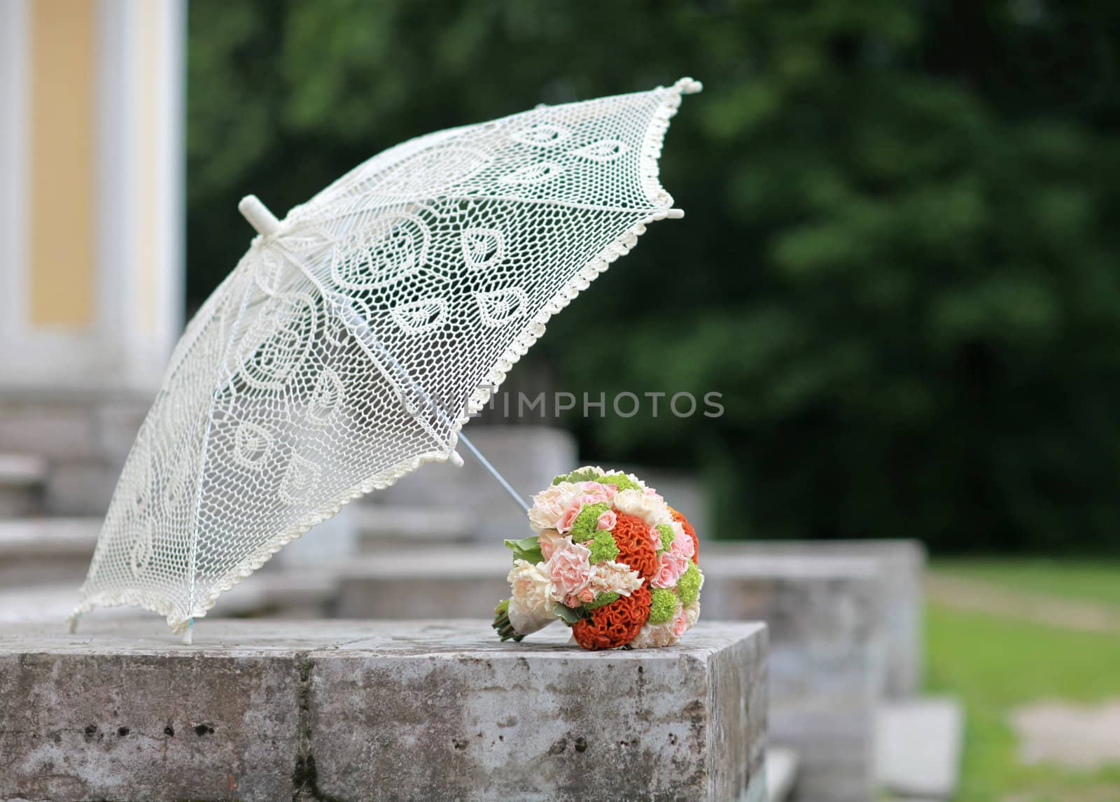 Summer lace parasol and a bouquet of bright colors