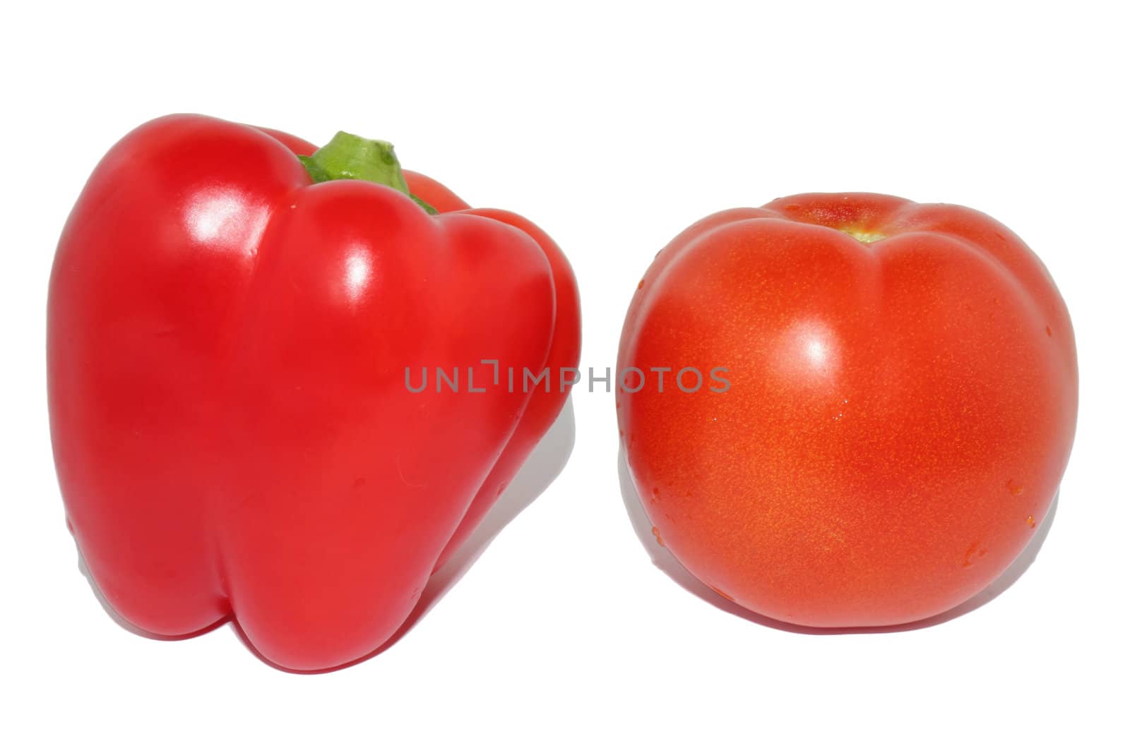 Red sweet pepper and red tomato on a white background