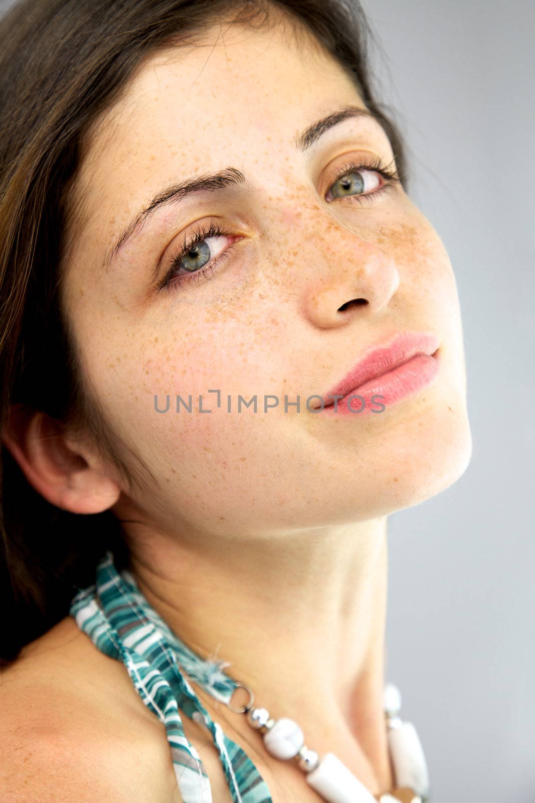 Beautiful girl with freckles and blue eyes by fmarsicano