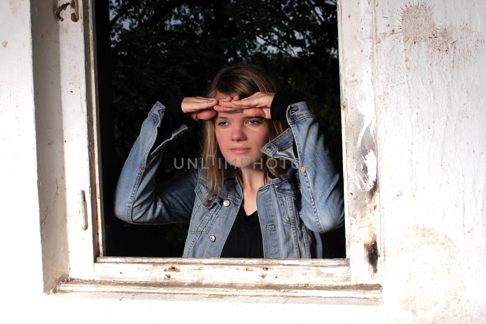 woman looking through window by Teka77