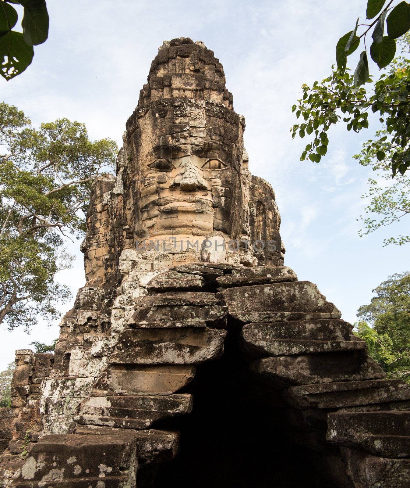 Carved stone south gate to Angkor Thom in Cambodia