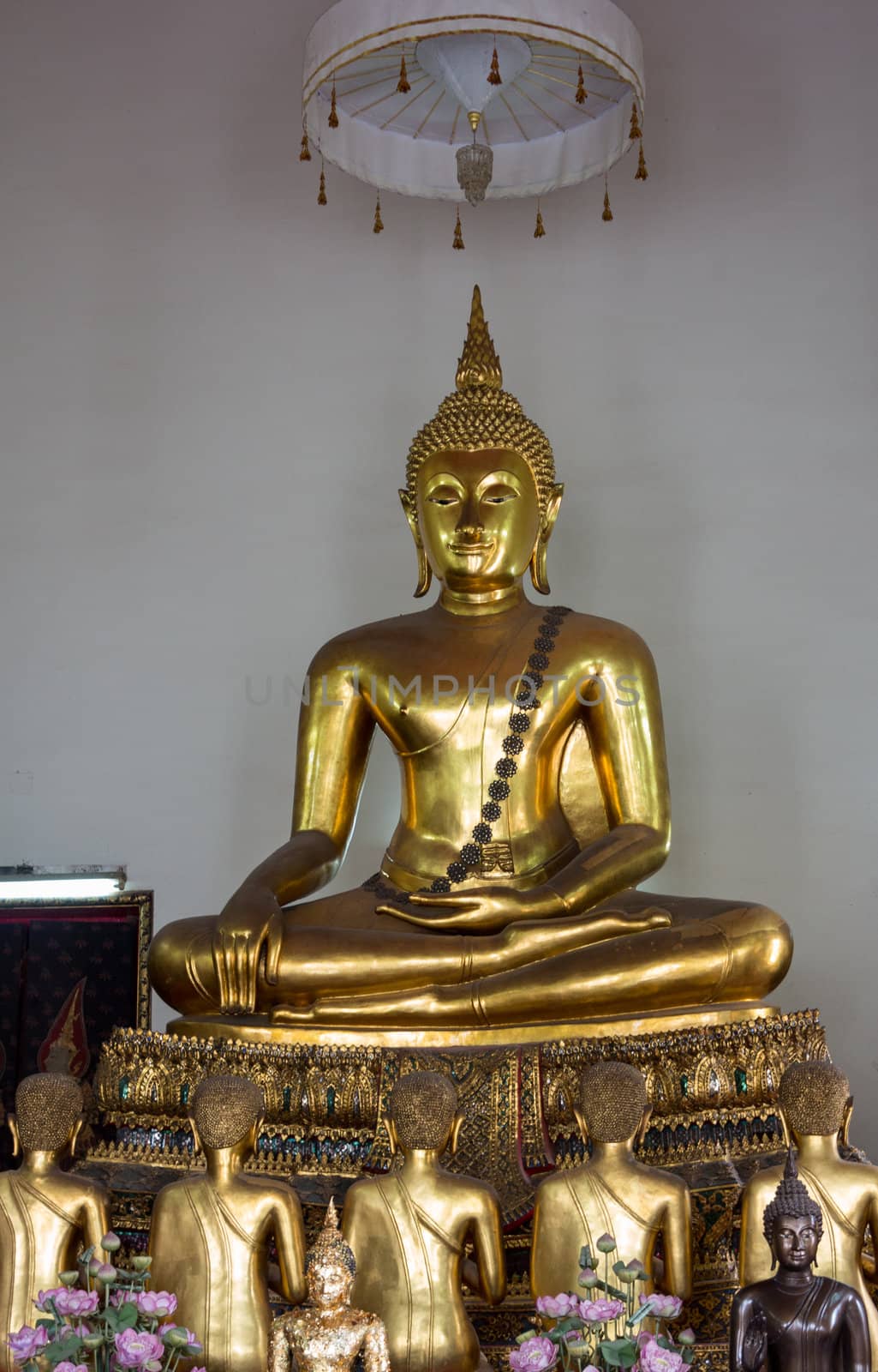 Ornate golden buddha statue in Wat Po temple near Bangkok in Thailand