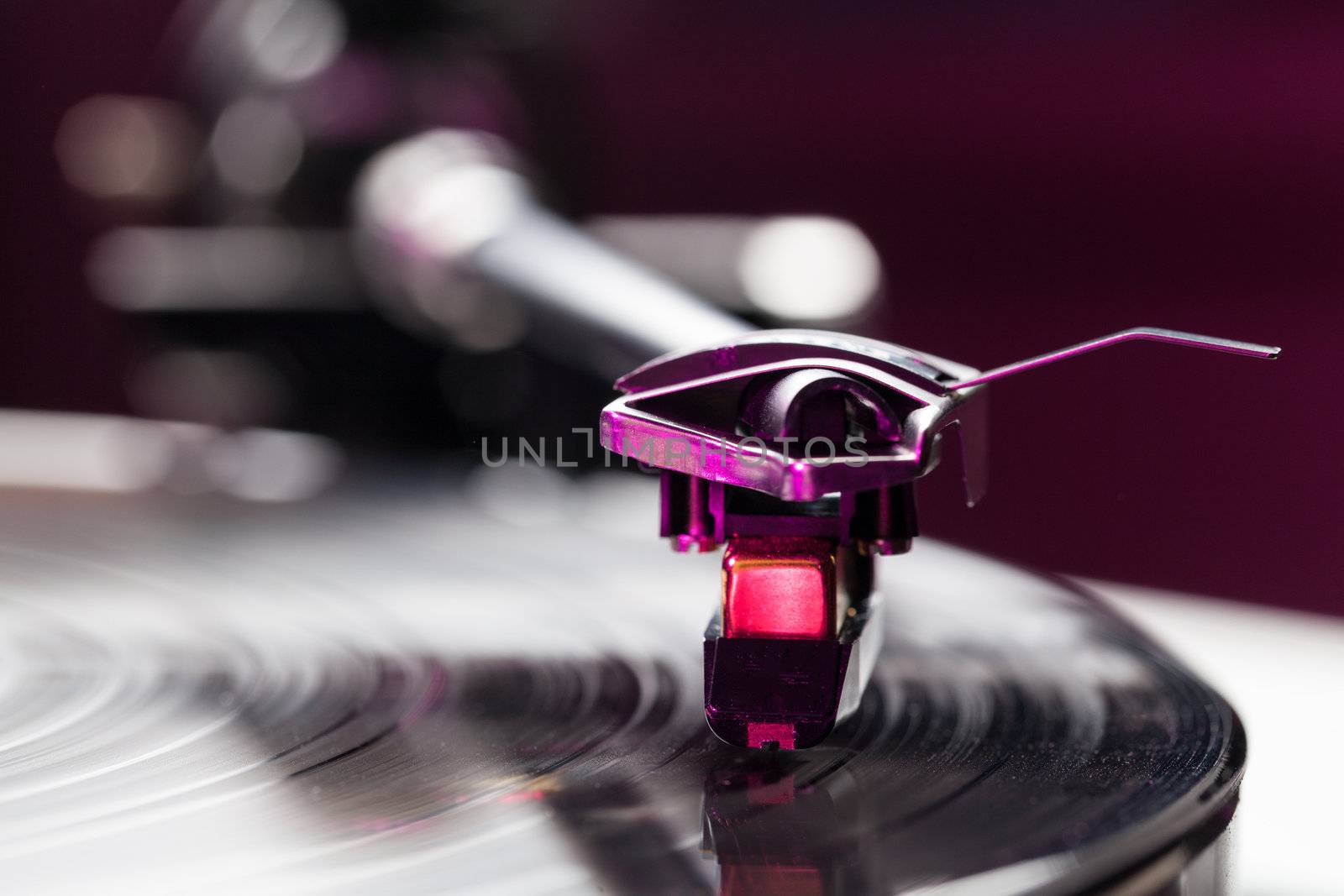 Long Playing record LP on retro record player with tone arm and cartridge