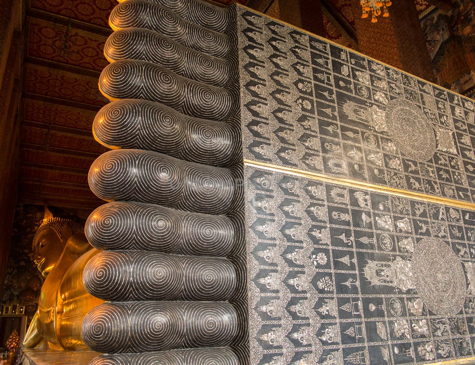 Detail of feet and toes of reclining Buddha in Wat Po Temple in Thailand