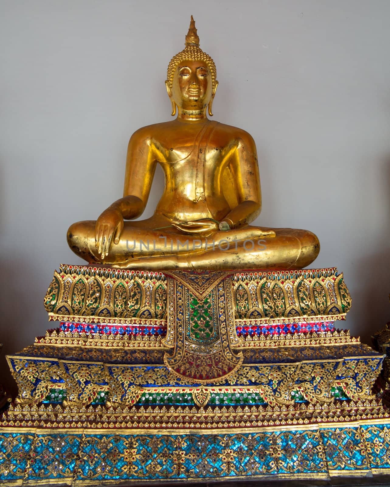 Ornate golden buddha statue in Wat Po temple near Bangkok in Thailand