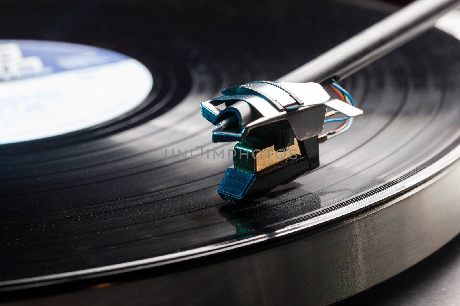 Long Playing record LP on retro record player with tone arm and cartridge