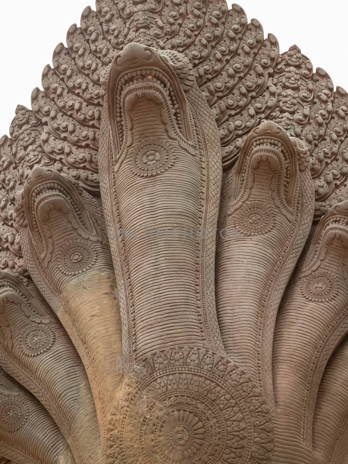 Detailed carving on wall of Angkor wat temple in Cambodia on cloudy day