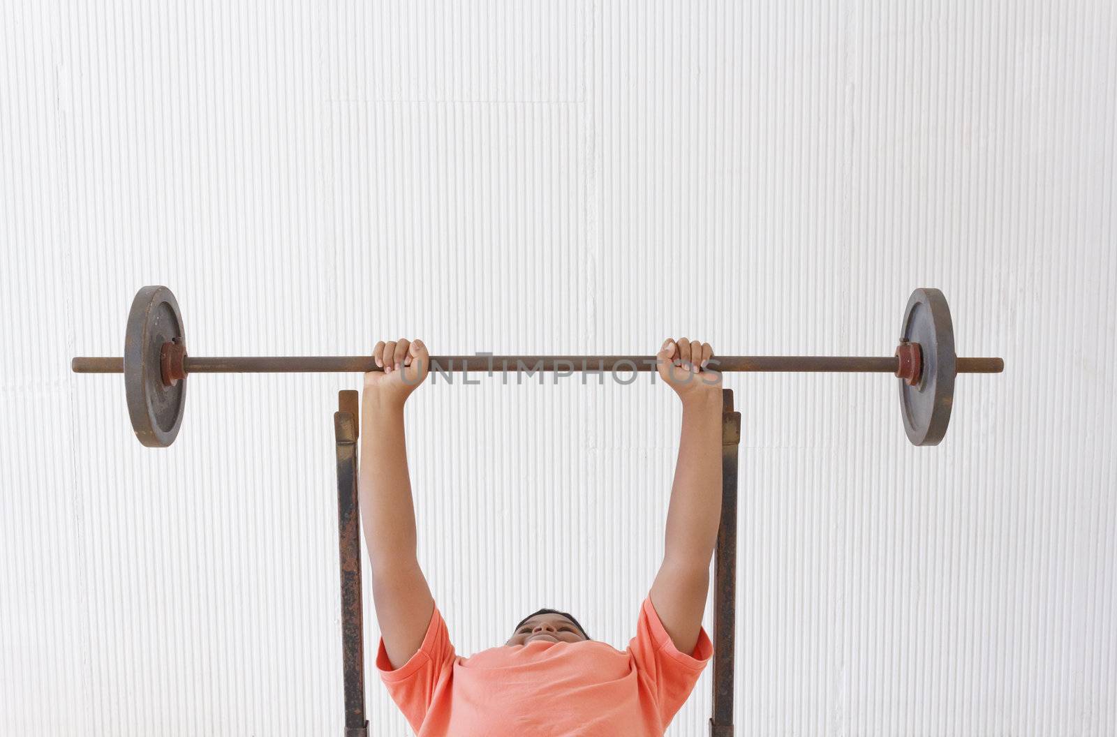 Thai boy lifting weights