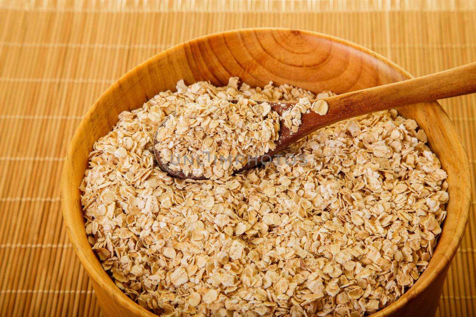 Bowl of Dried Oats in Wood Bowl by dbvirago