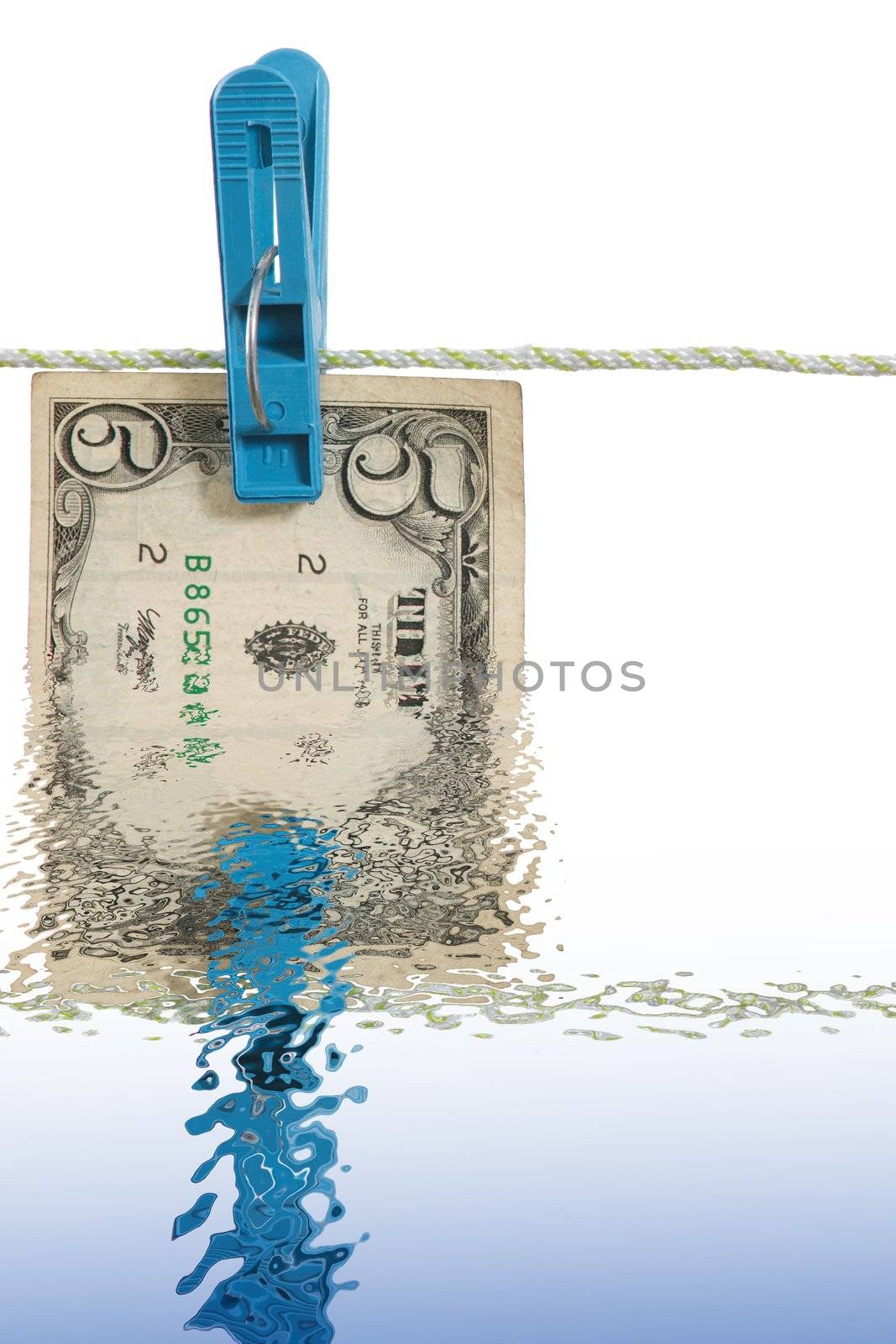 A reflect of five dollars banknote in water