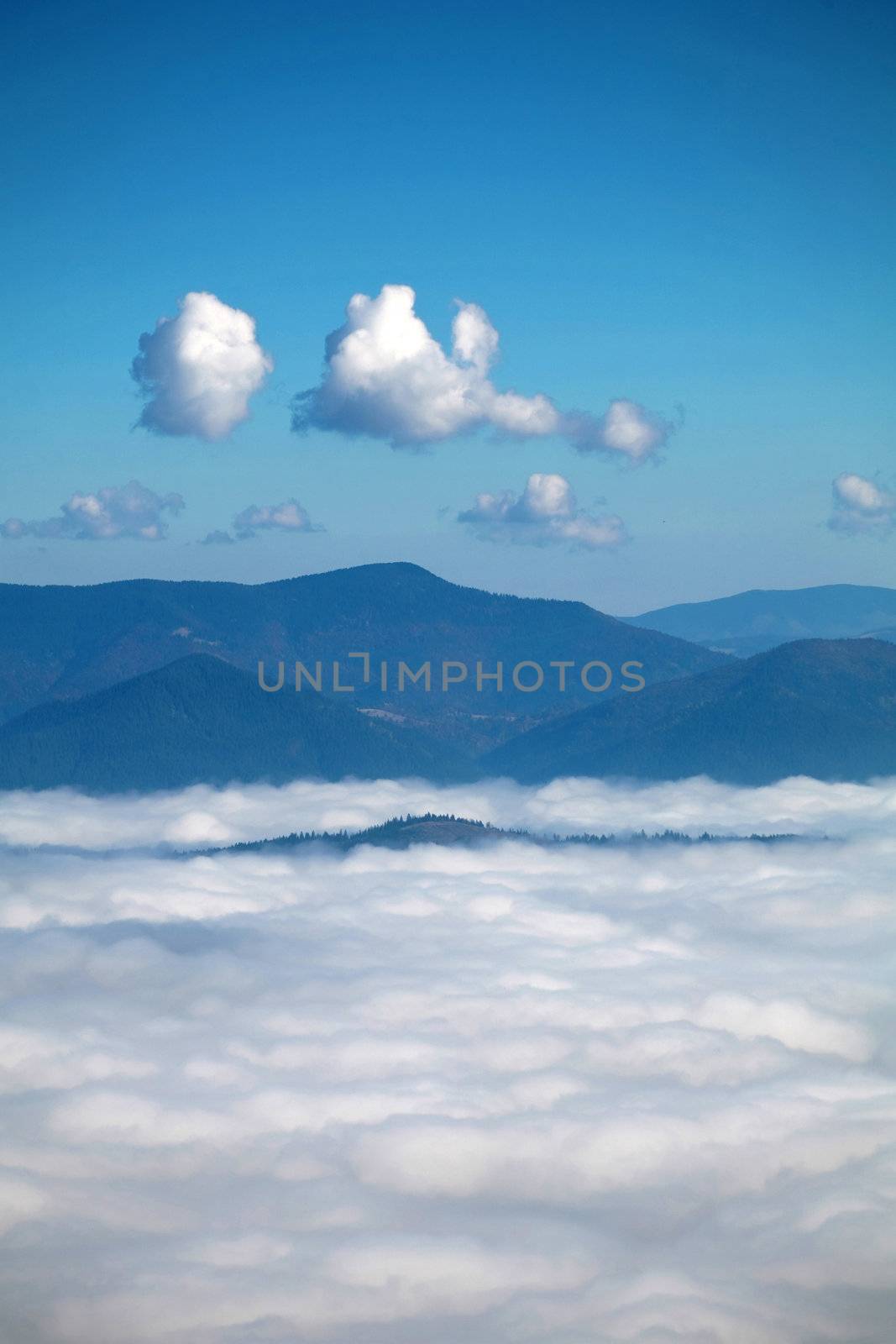 An image a clouds in a mountain