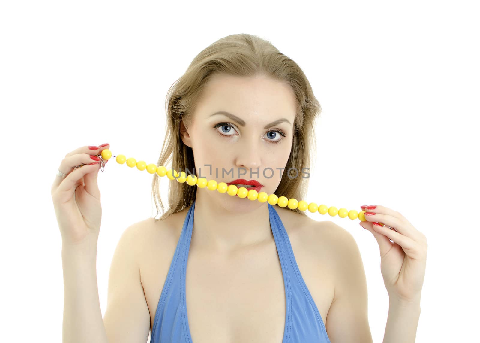 Close-up of woman with yellow necklace in her mouth. Isolated on white.