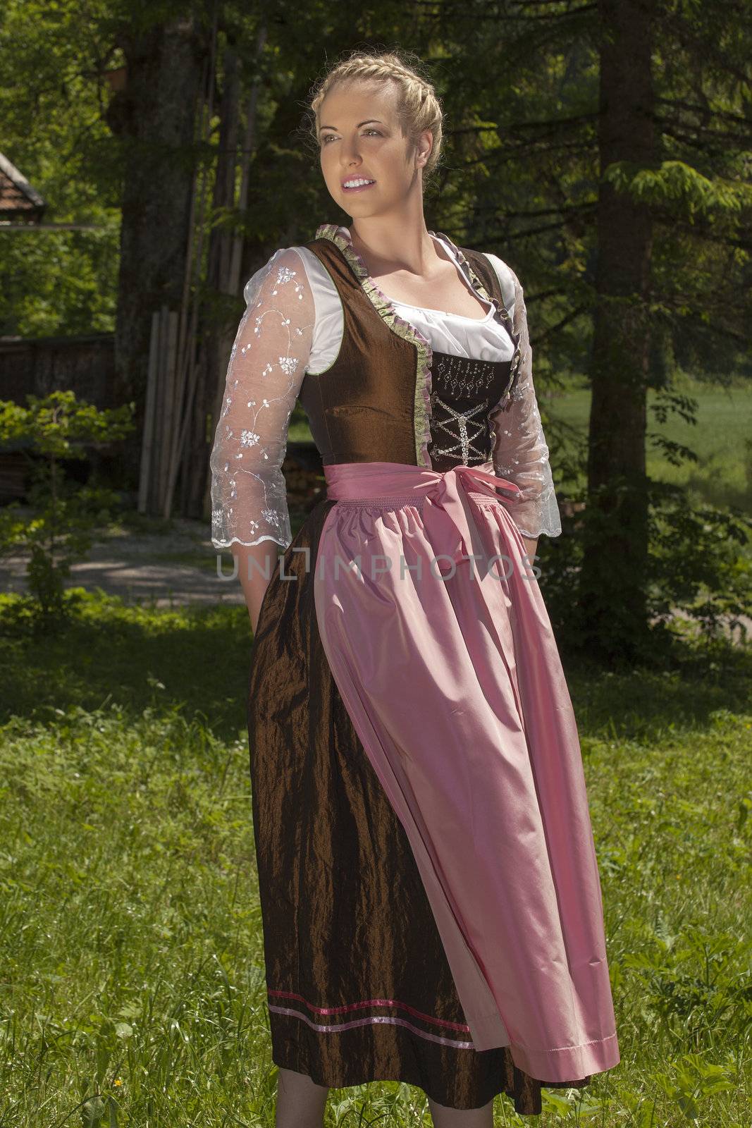 Young Bavarian woman in a fashionable dress silk dress