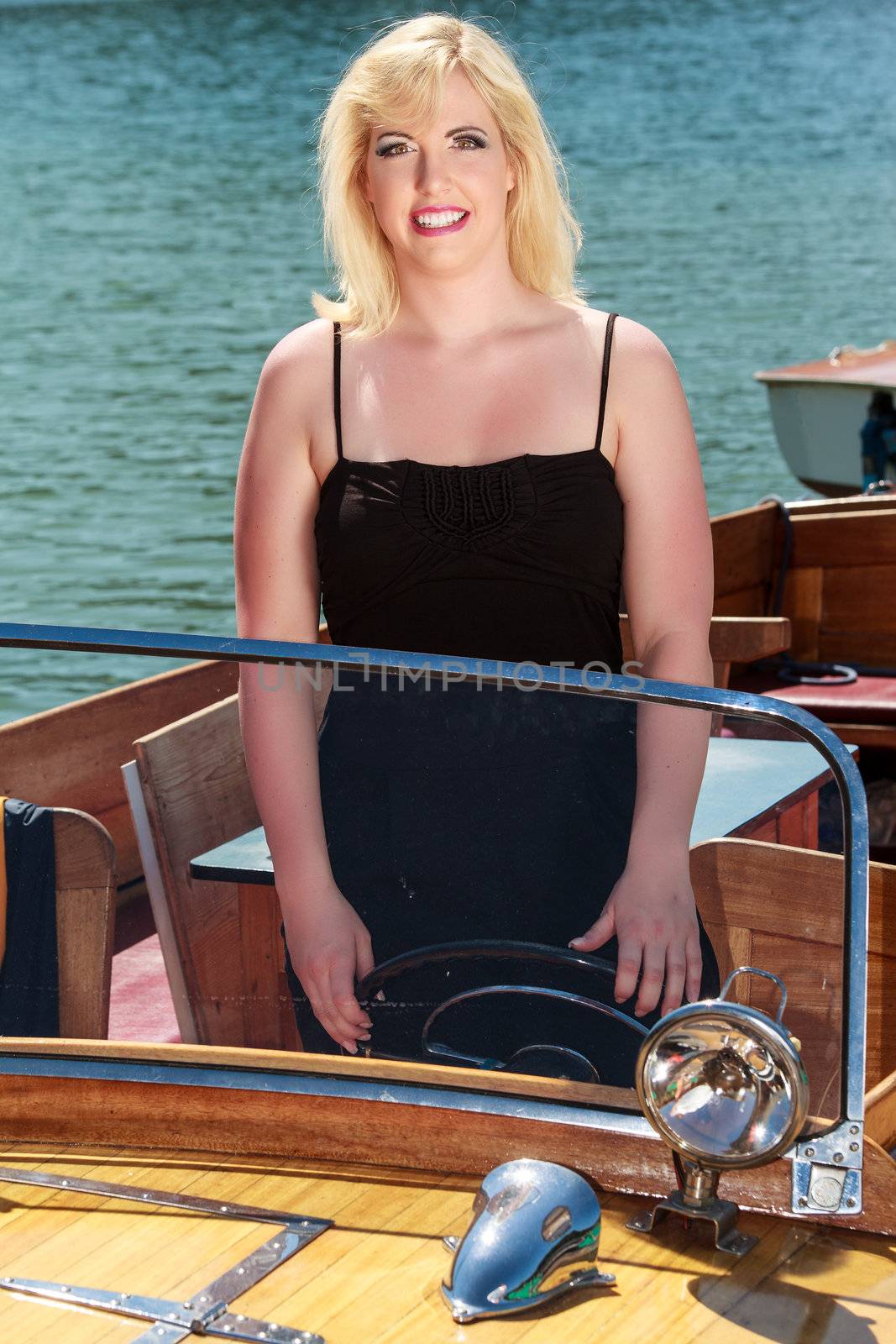 Blonde woman in boat by STphotography