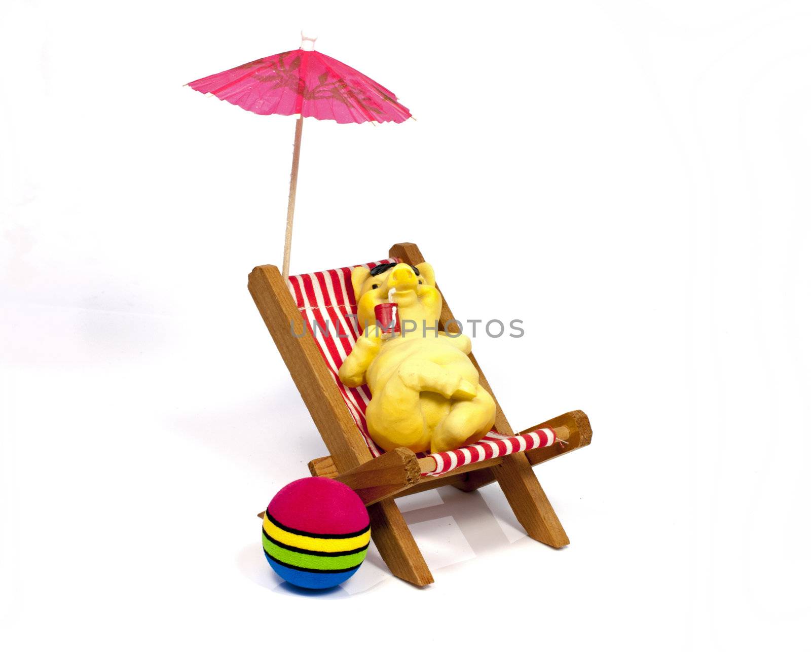 yellow bear in a beach chair drinking with a straw