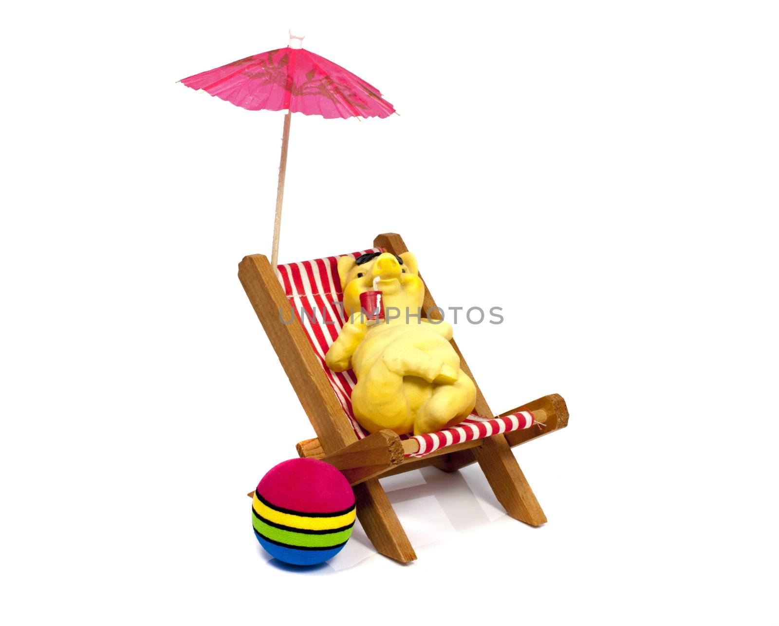 yellow bear in a beach chair drinking with a straw