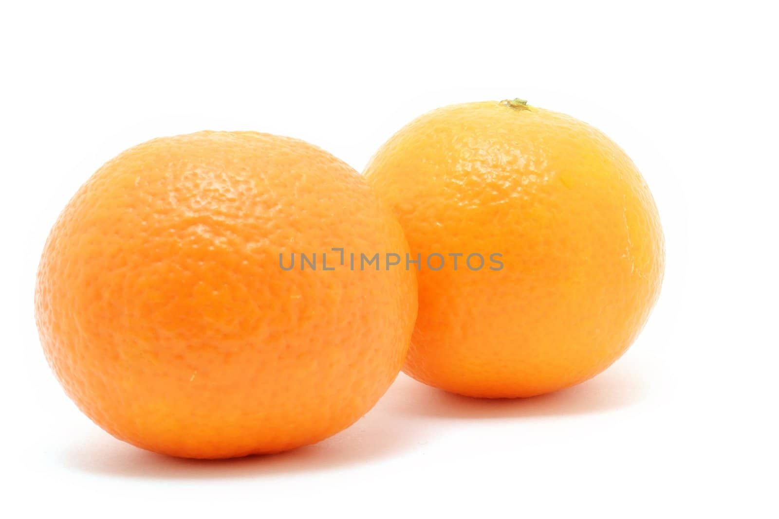 Couple of fresh oranges isolated over white background