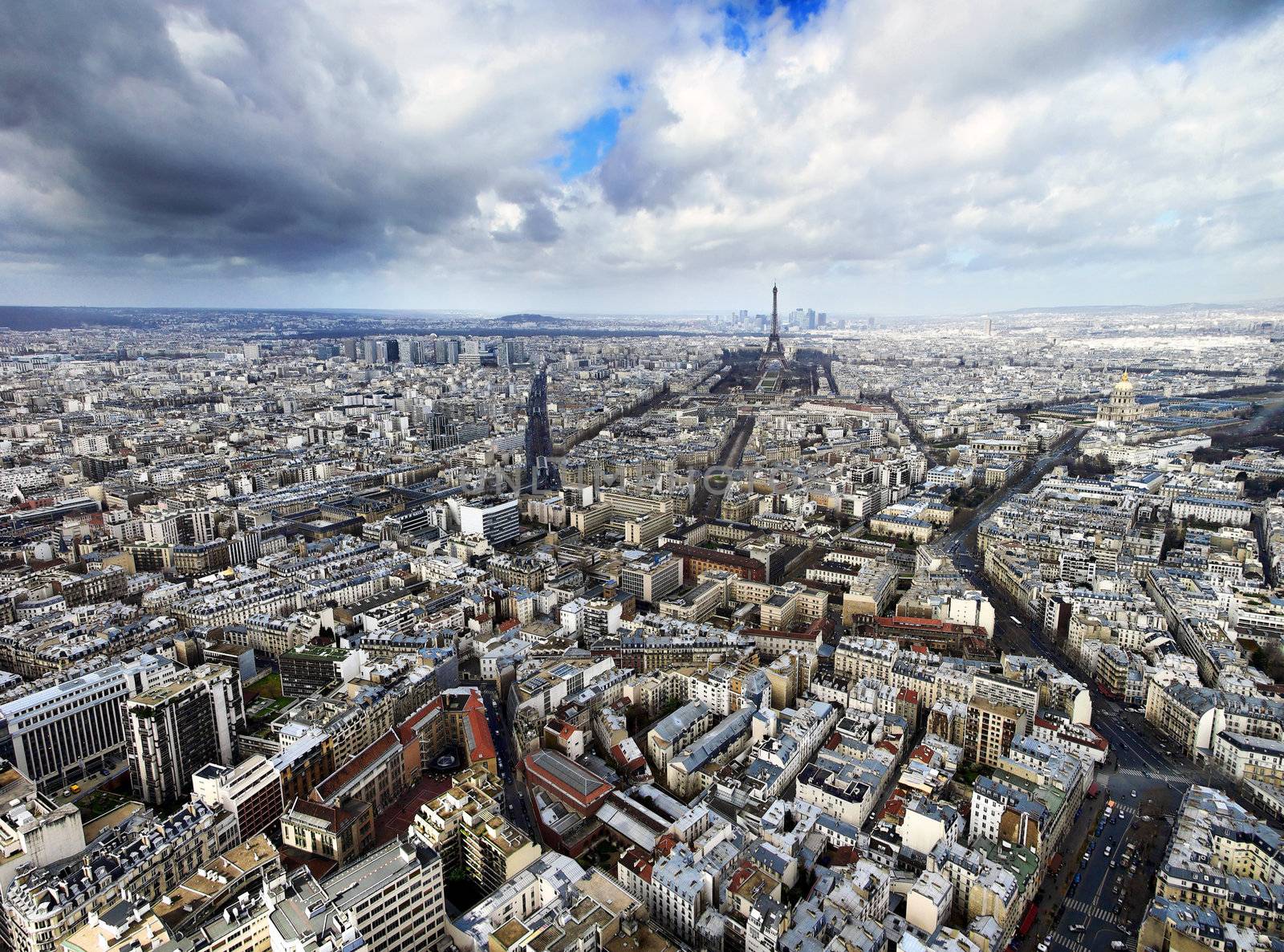 aerial view of paris with the eiffel tower at the horizon