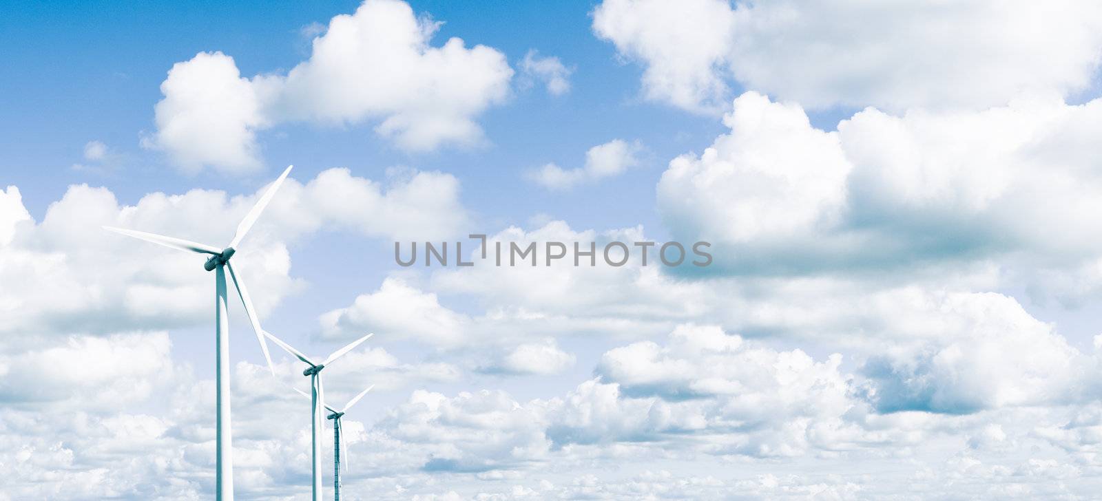 Wind turbines in front of cloudy sky