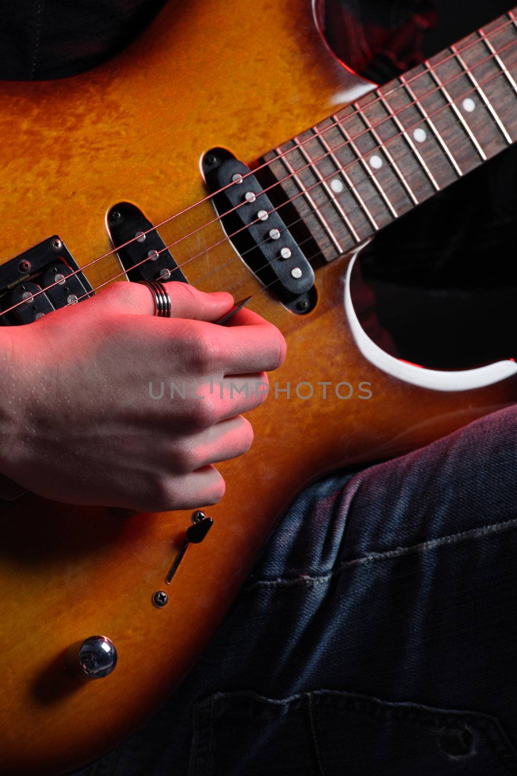 guitar player close up by stokkete