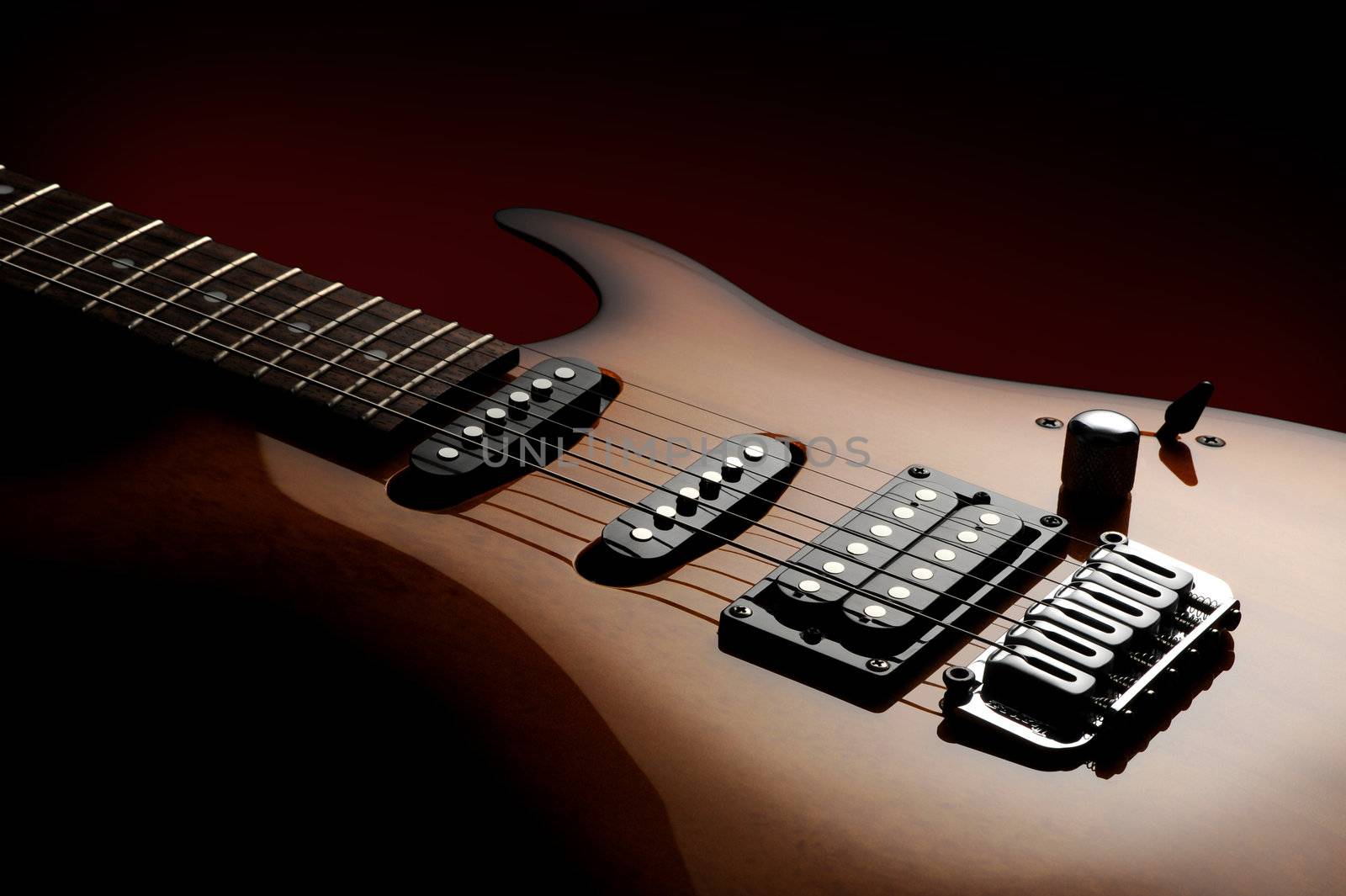  close up of a electric guitar on dark background