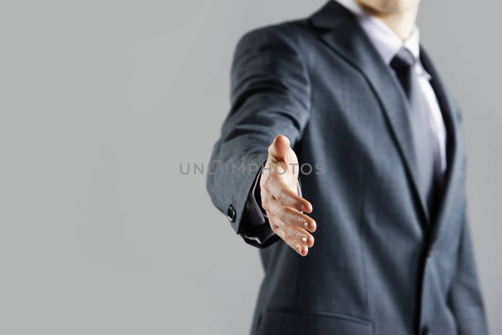 Businessman offering for handshake, close up hand by stokkete