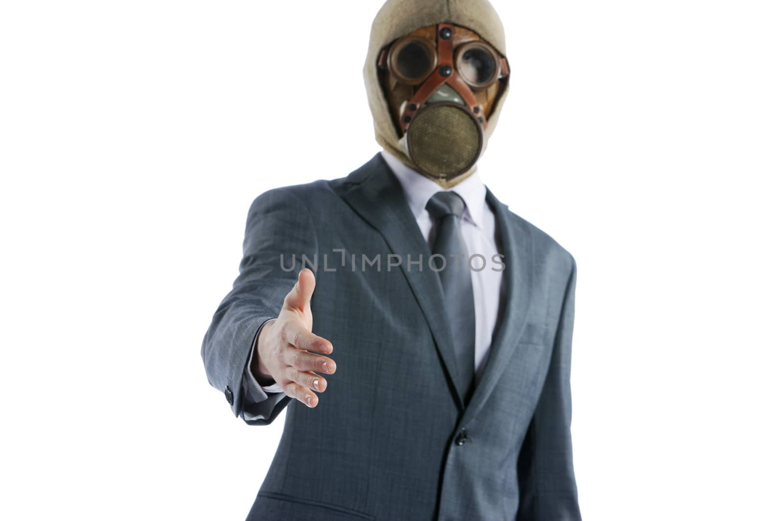 portrait of businessman in a gas mask offering for handshake by stokkete