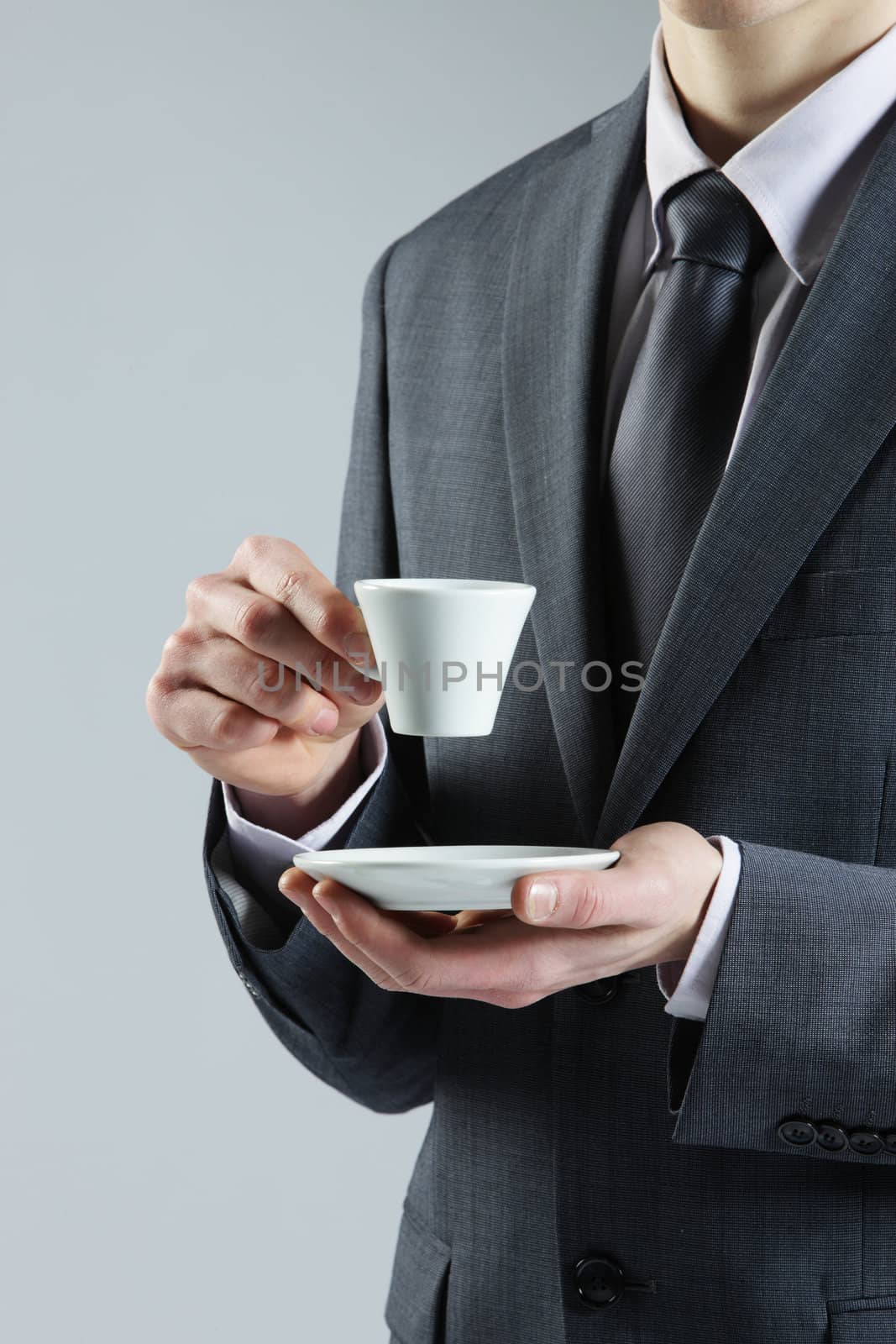 close up business man with coffee cup by stokkete