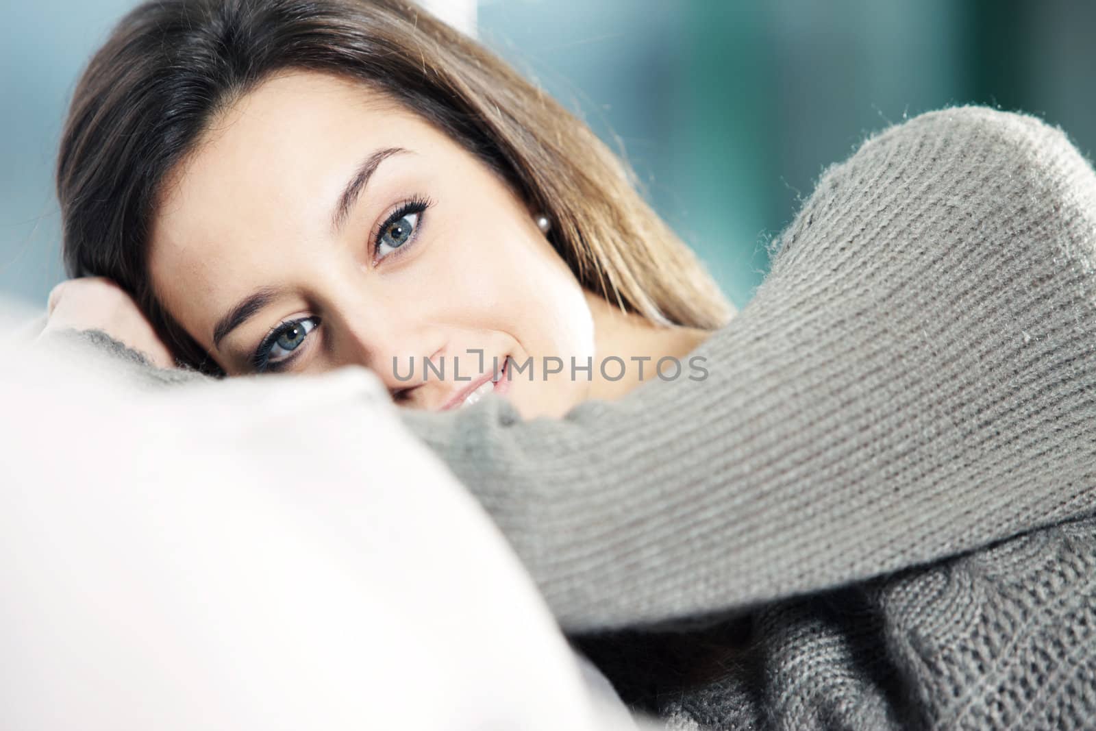 Portrait of a beautiful young woman on couch