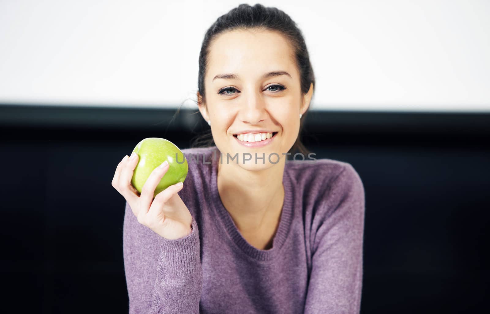 portrait of a beautiful young woman wiyh green apple by stokkete