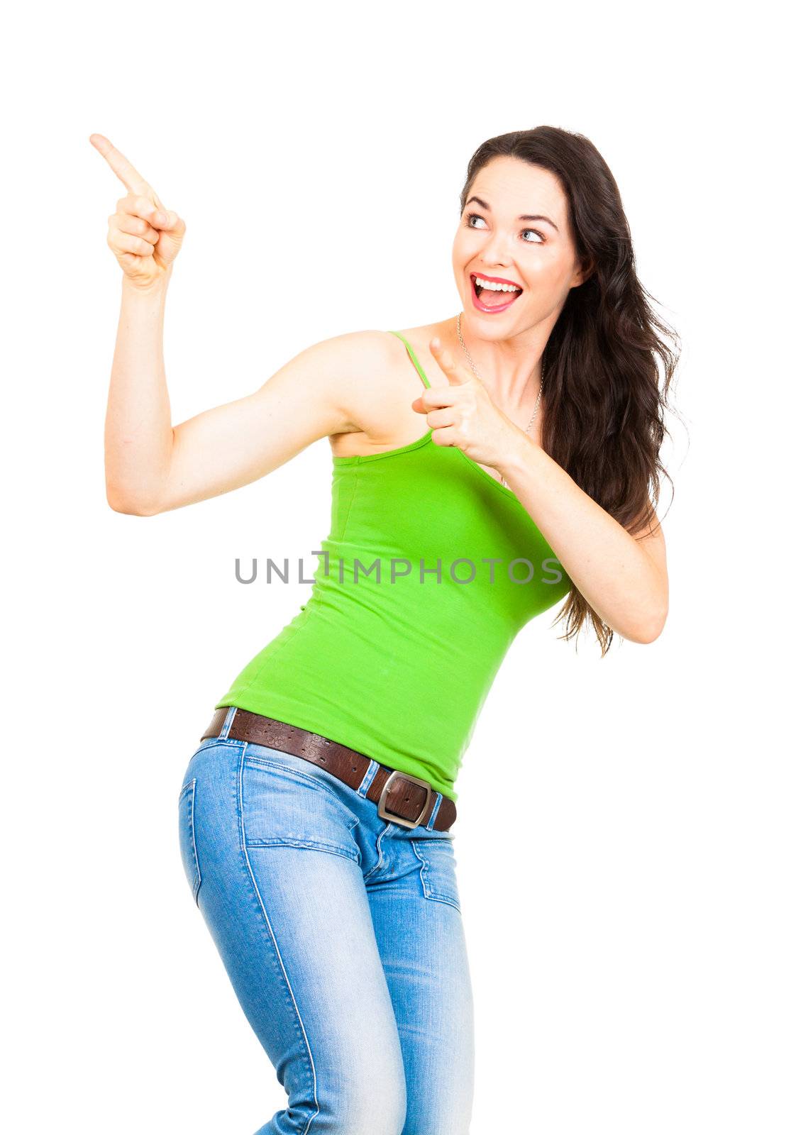 A young beautiful happy woman smiling and pointing to copyspace. Isolated on white.