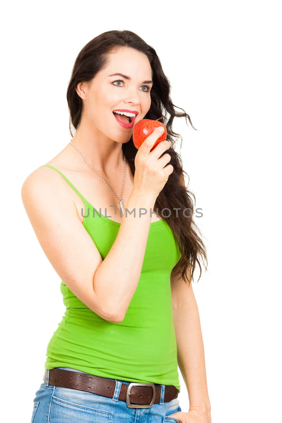 A beautiful young woman biting an apple. Isolated on white