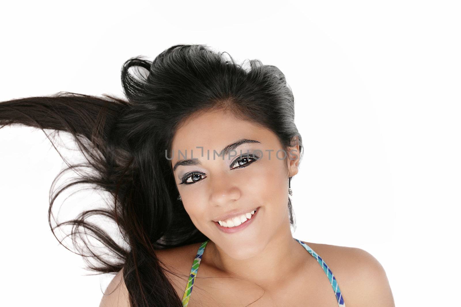 beauty portrait of young brunette woman with hair style laying down on white